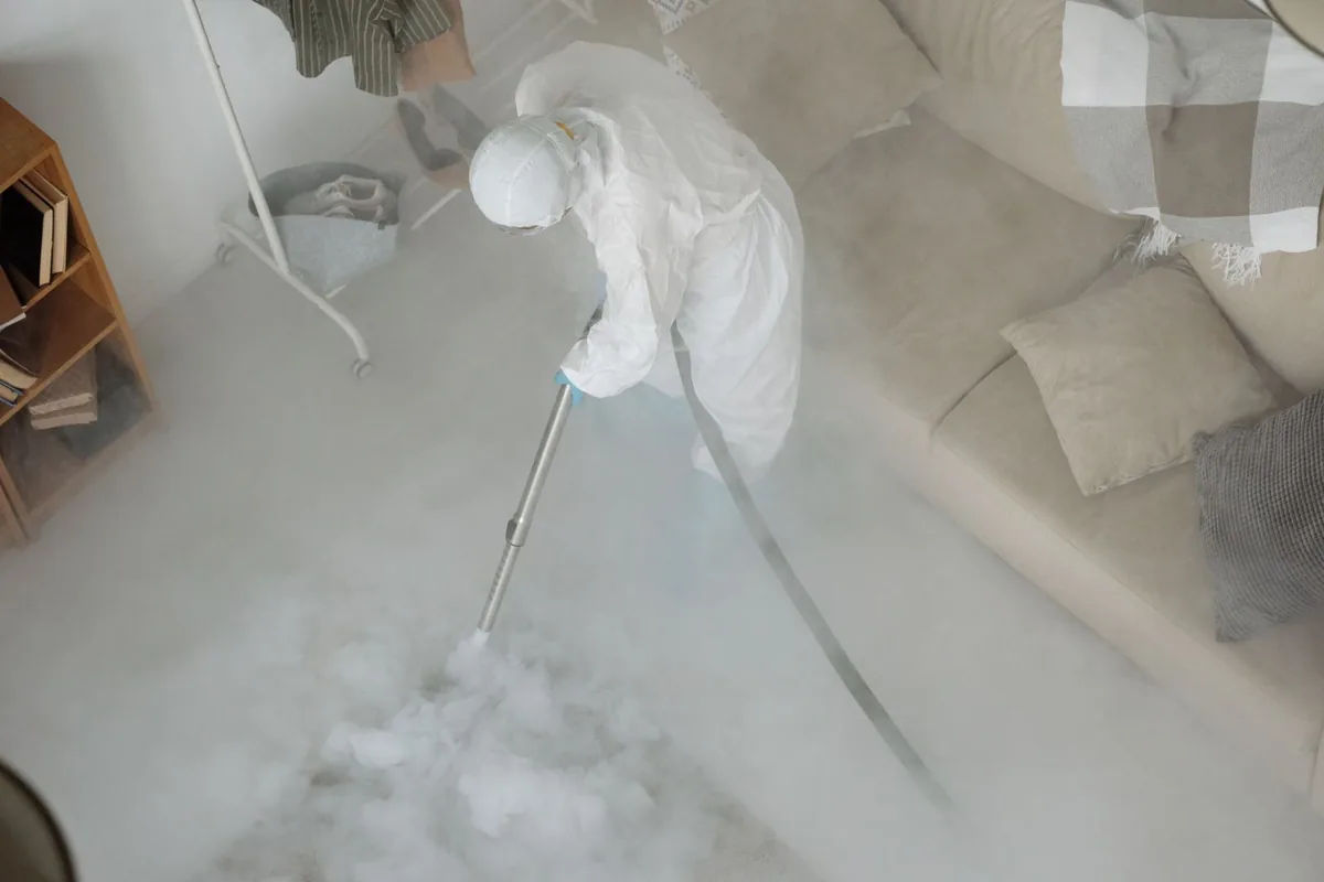 Biohazard cleanup technician in protective equipment, East Queen Anne, Seattle, WA
